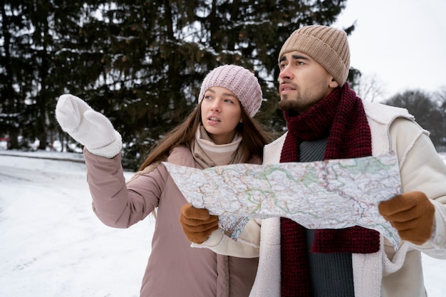 Couple with map medium shot