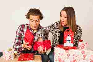 Free photo couple with open present boxes