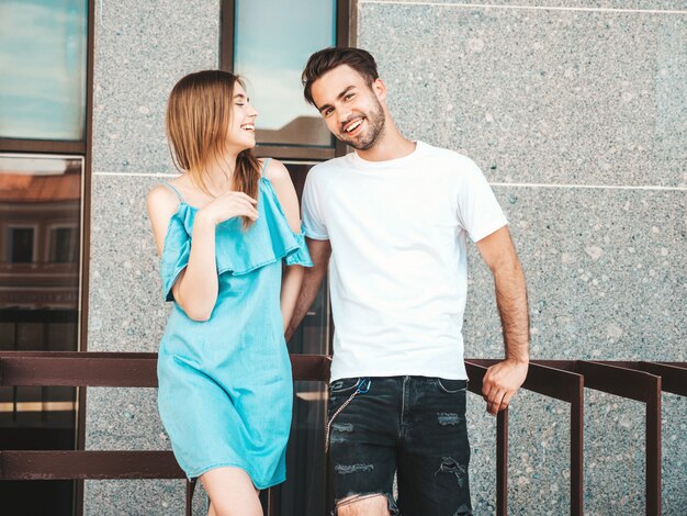 Couple with sunglasses posing in the street