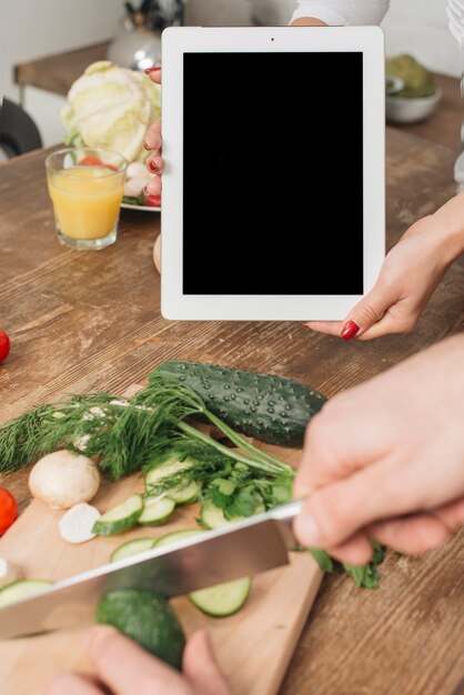 couple with tablet template in kitchen