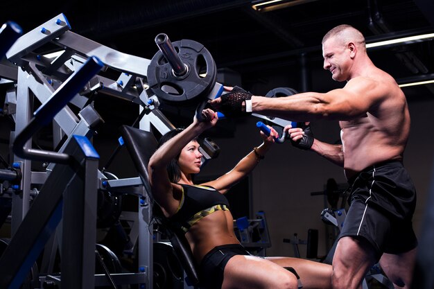 Couple working out at a gym