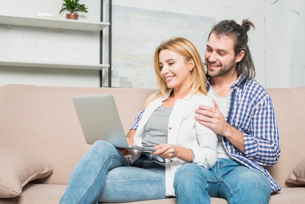 Couple working with laptops