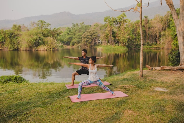 Couple and yoga in the nature