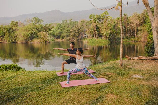 Couple and yoga in the nature