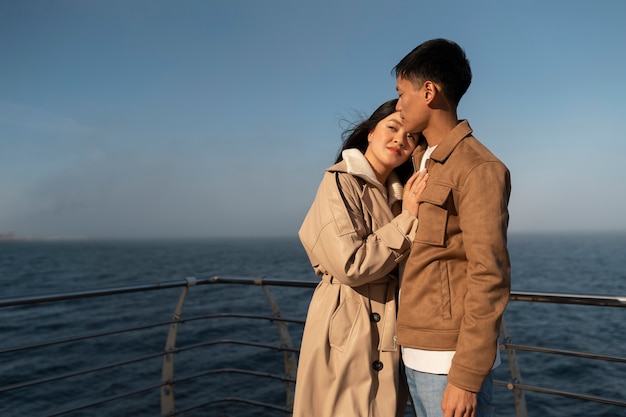 Couples embracing near the sea