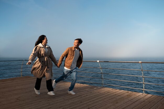 Couples embracing near the sea