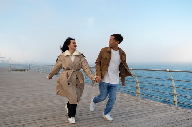 Couples embracing near the sea