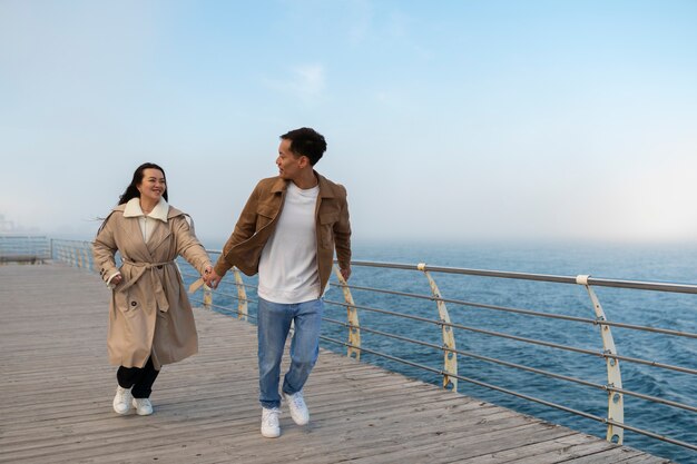 Couples embracing near the sea