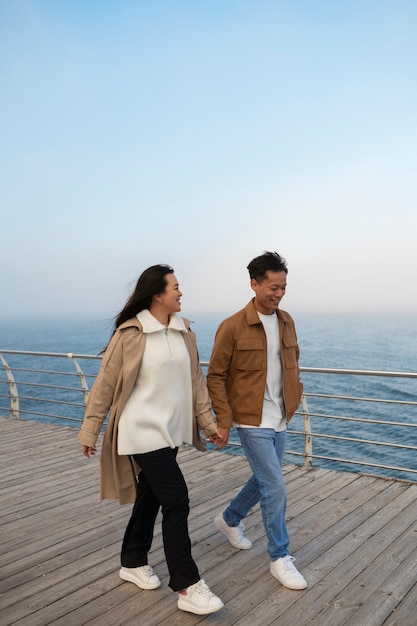 Couples embracing near the sea