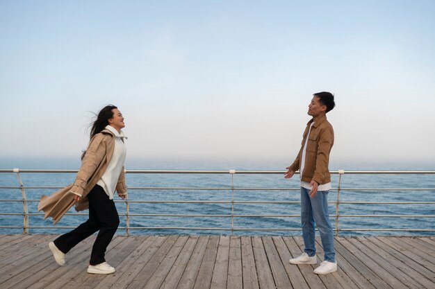 Couples embracing near the sea