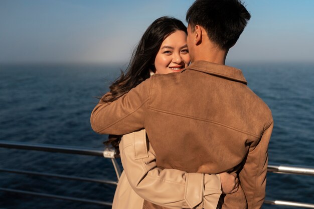 Couples embracing near the sea