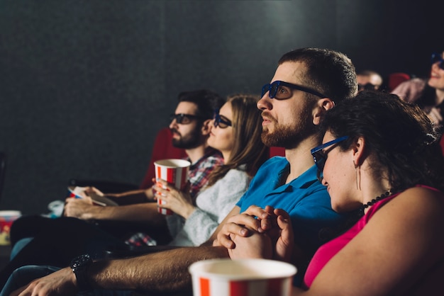 Couples watching film in cinema