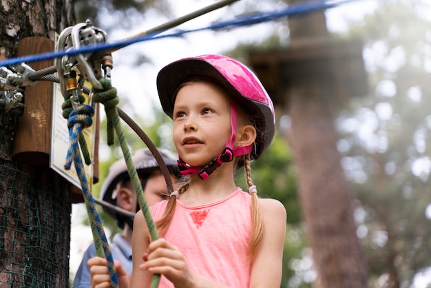 Free photo courageous kids having fun at an adventure park