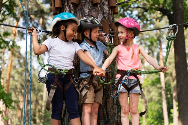 Courageous kids having fun at an adventure park