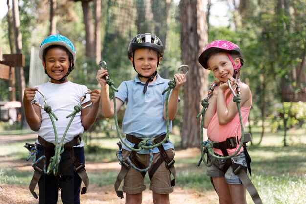 Courageous kids playing in an adventure park