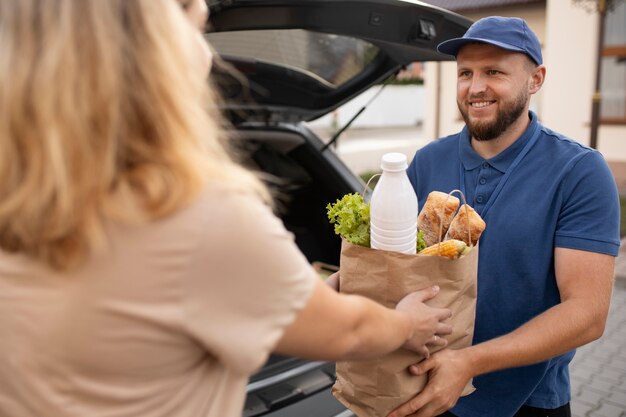 Courier delivering groceries home