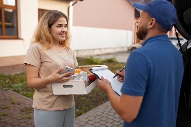 Courier delivering groceries home