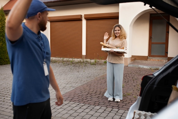 Courier delivering groceries home