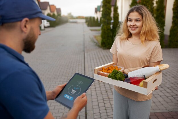 Courier delivering groceries home