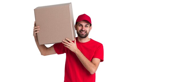 Courier man holding on his shoulder a big delivery box