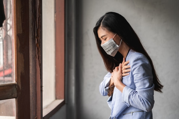 Premium Photo | Covid-19 pandemic coronavirus, asian woman wearing mask,  have a symptoms coughing and fever