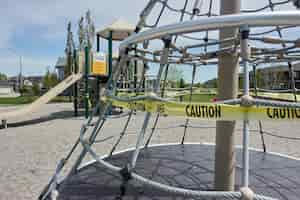 Free photo covid 19 restrictions signs in a playground