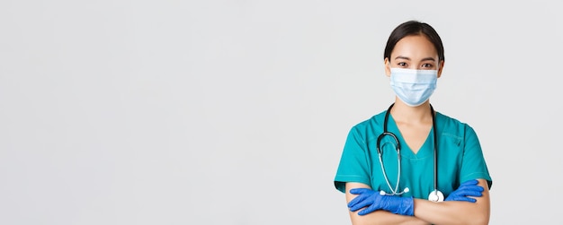 Free Photo covid coronavirus disease healthcare workers concept closeup of confident smiling professional asian...