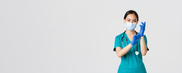 Free photo covid coronavirus disease healthcare workers concept professional and confident smiling asian physic...