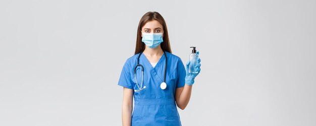 Covid preventing virus health healthcare workers and quarantine concept serious female nurse in medi