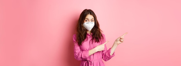 Free photo covid quarantine and social distancing concept stylish female model in respirator wearing face mask