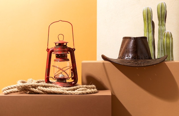 Free photo cowboy inspiration with hat and lamp