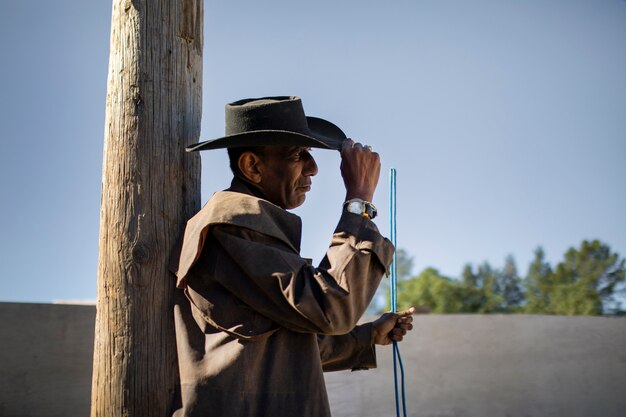 Cowboy silhouette against warm light