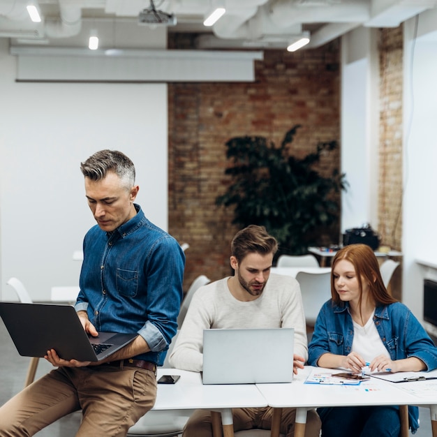 Coworkers discussing a business project indoors