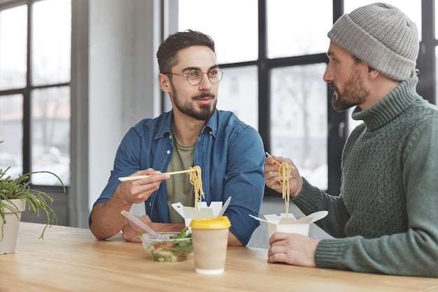 Coworkers having lunch in office