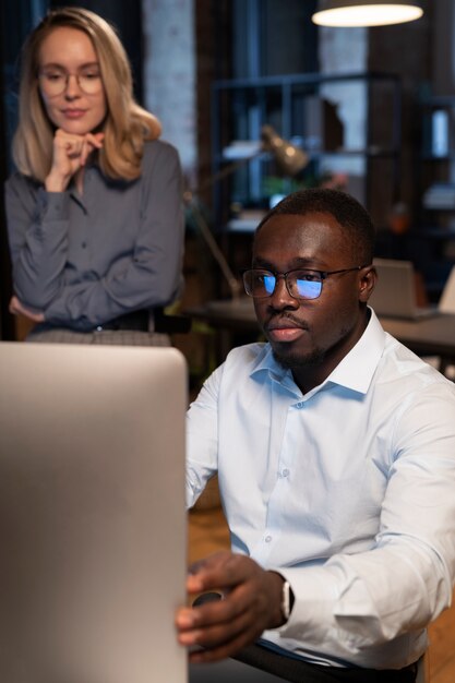 Coworkers looking the monitor