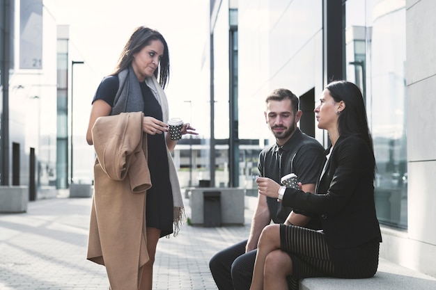 Coworkers with coffee at office