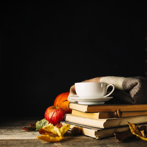 Cozy autumnal composition with books