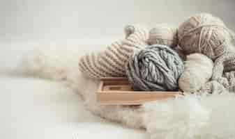 Free photo cozy background wallpaper with the yarn for knitting.