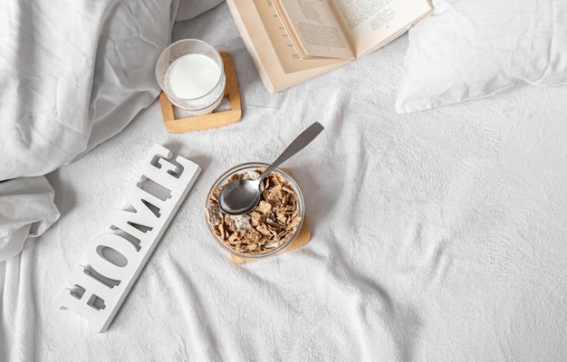 Cozy composition with cereal and milk in bed
