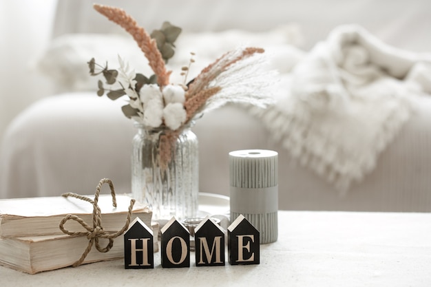 A cozy composition with details of the interior decor and the decorative word home.