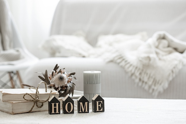 A cozy composition with details of the interior decor and the decorative word home.