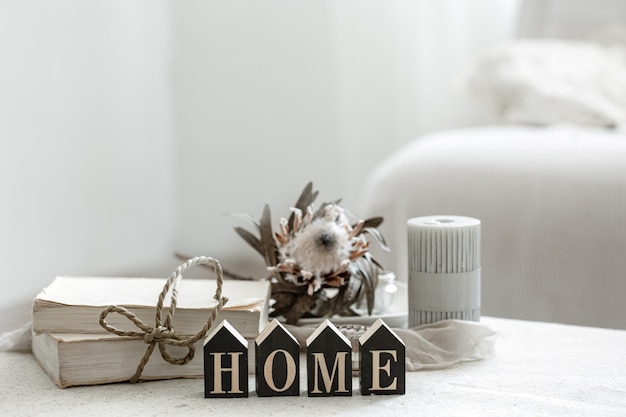 a cozy composition with details of the interior decor and the decorative word home.