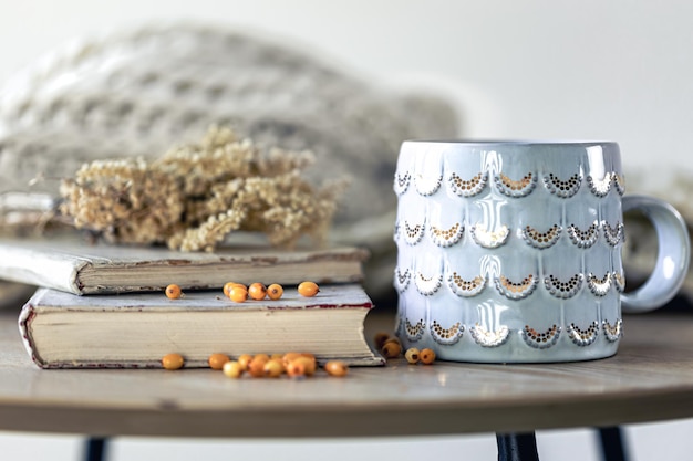 Cozy home composition with books on the table closeup