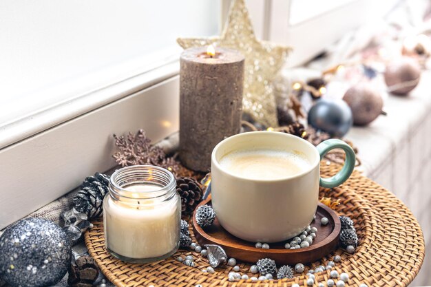 Cozy home composition with a cup of coffee and decor closeup