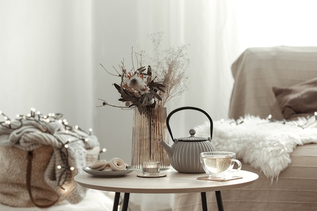 Free photo cozy home composition with tea in a scandinavian style home interior.