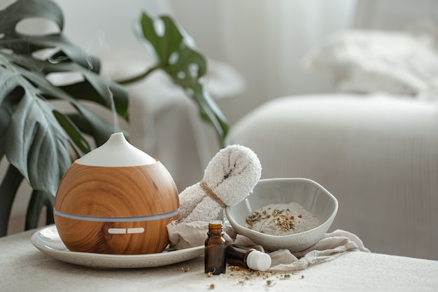 Cozy still life with a humidifier in the interior of the room on a blurred background.