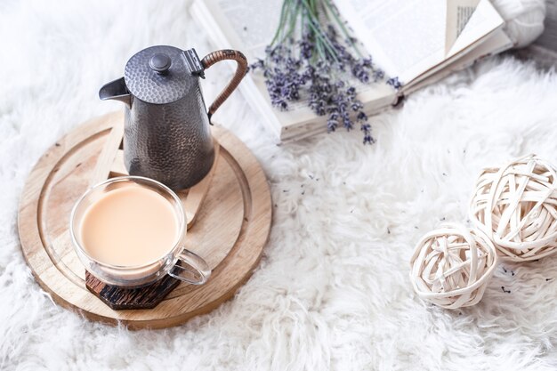 Cozy still life with a kettle and a Cup of hot drink