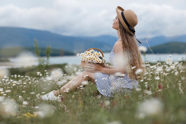 cozy woman in field of daisies