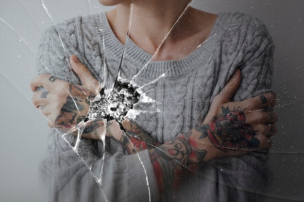 Free photo cracked glass effect with depressed woman background