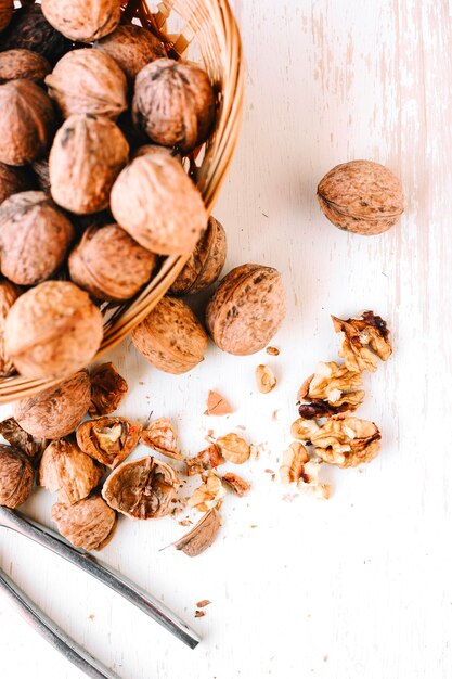 Cracked walnuts on wooden table